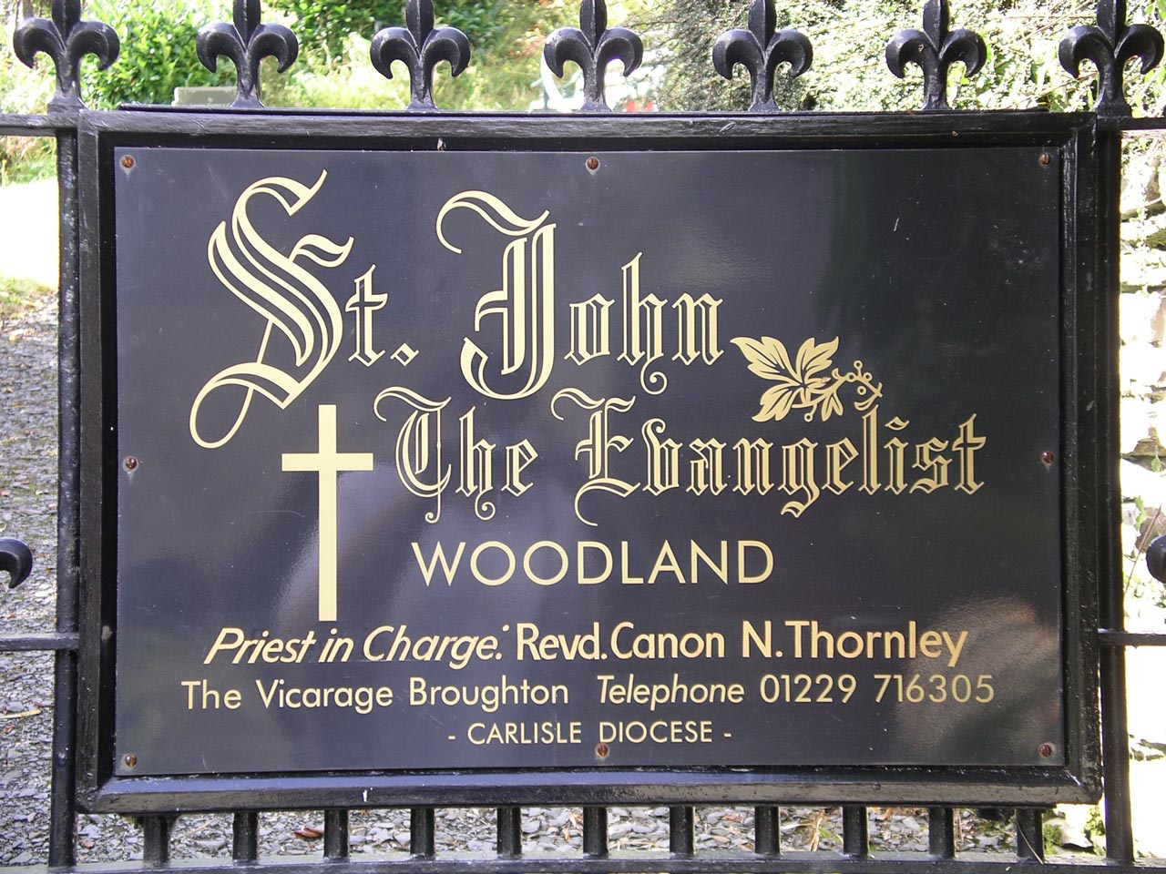 Sign at the Church of St John the Evangelist, Woodland